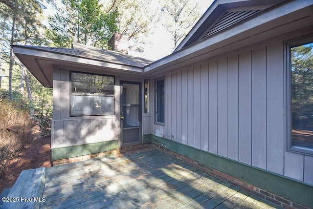 view of side of property with a wooden deck