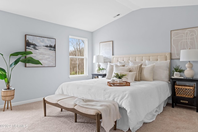 bedroom featuring visible vents, baseboards, lofted ceiling, and carpet floors