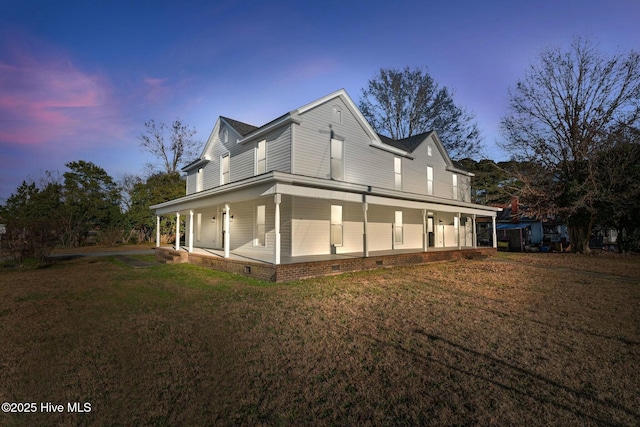 exterior space featuring a porch and a lawn