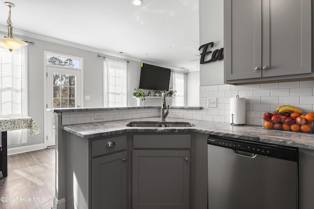 kitchen with gray cabinets, sink, hardwood / wood-style flooring, stainless steel dishwasher, and kitchen peninsula