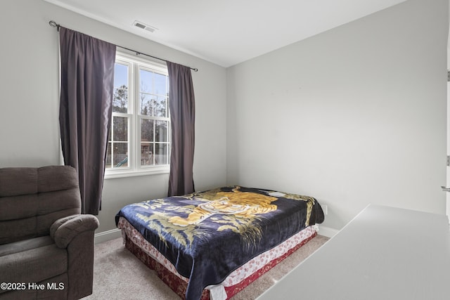 bedroom featuring light colored carpet