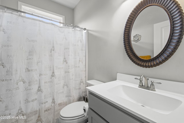 bathroom featuring vanity and toilet