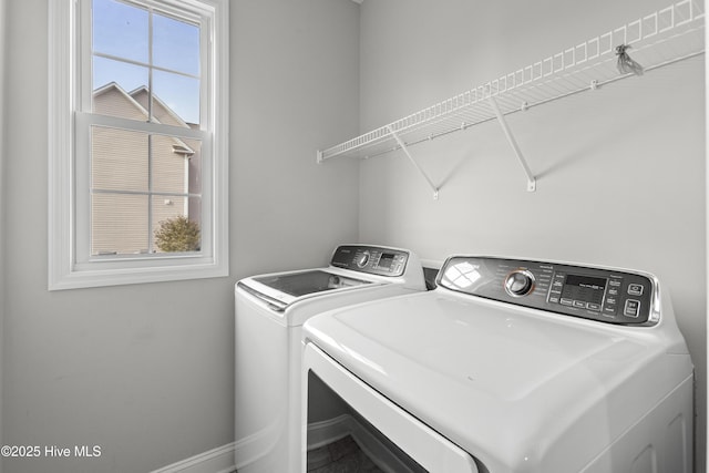 laundry area with washing machine and dryer