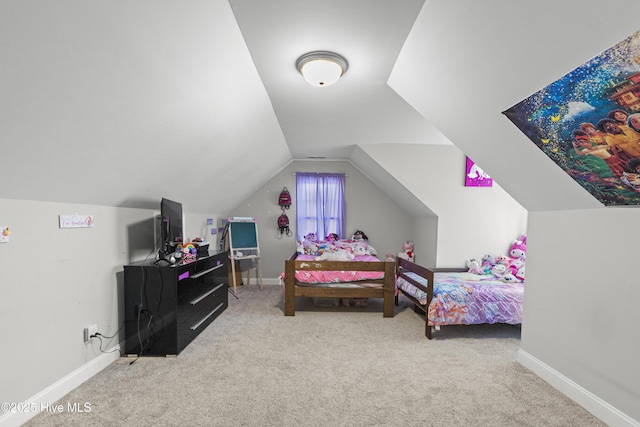 bedroom featuring vaulted ceiling and light carpet