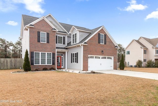 view of front of property with a garage and a front lawn