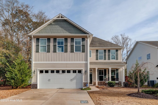 view of front of house featuring central AC, covered porch, and a garage