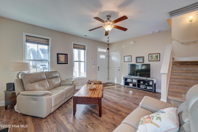 living room with ceiling fan and hardwood / wood-style flooring