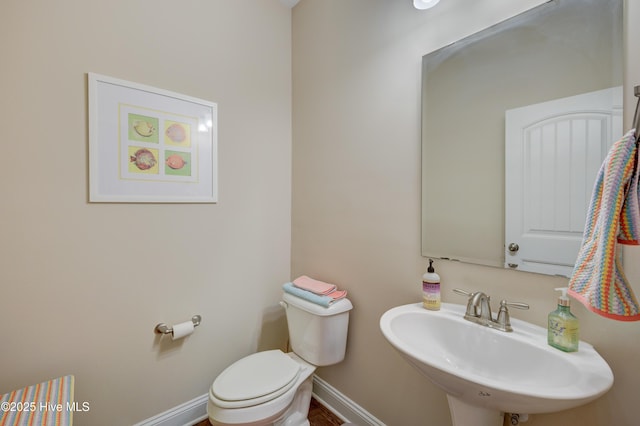 bathroom with toilet and sink