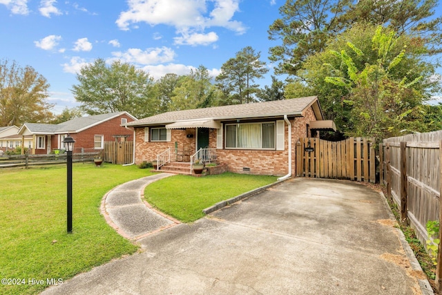 ranch-style house with a front lawn