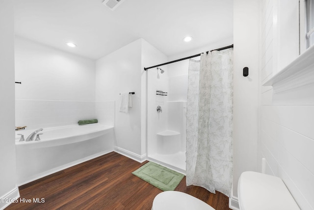 bathroom featuring separate shower and tub, wood-type flooring, and toilet