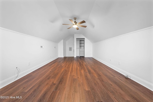 bonus room featuring dark hardwood / wood-style flooring, ceiling fan, and lofted ceiling