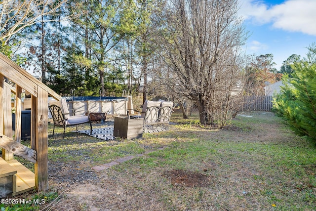 view of yard with a covered pool