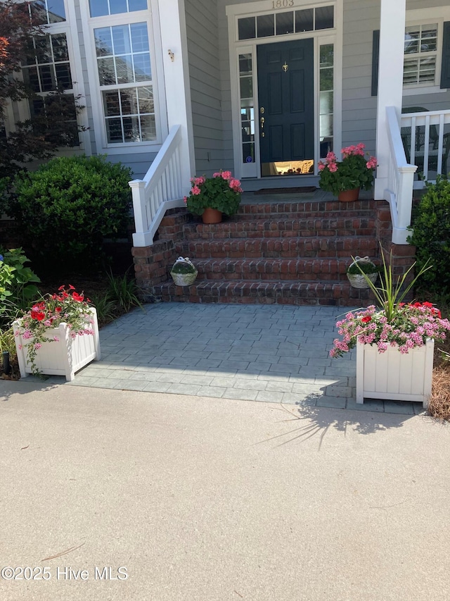 property entrance featuring covered porch