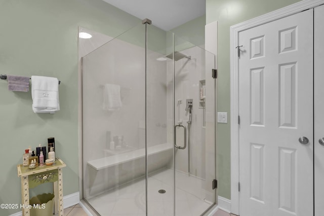 bathroom with tile patterned flooring and walk in shower