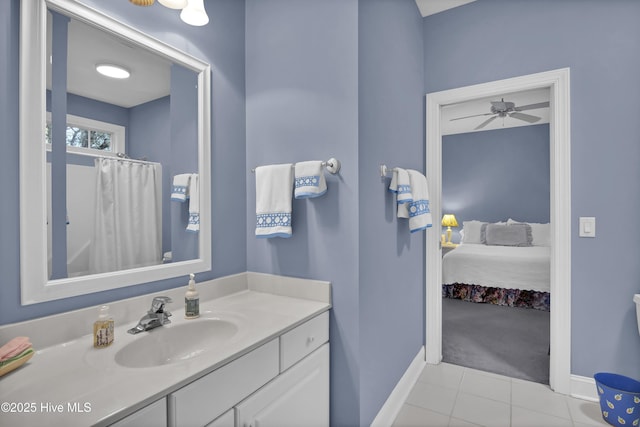 bathroom featuring tile patterned flooring, vanity, and ceiling fan