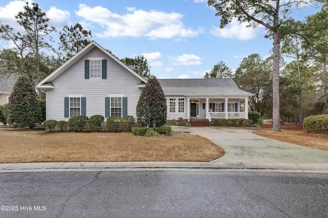 view of front property featuring a front yard and covered porch