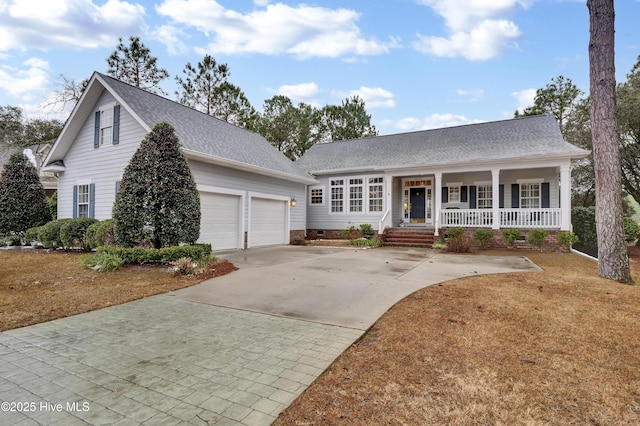 front facade with a garage and a porch