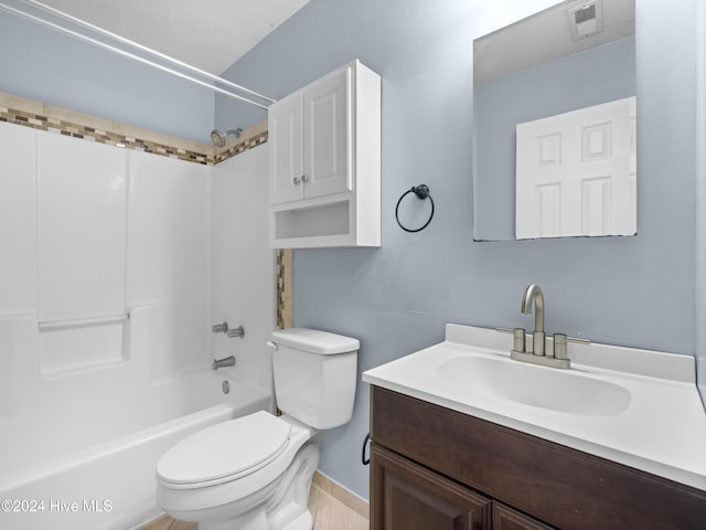 full bathroom featuring vanity, shower / bathtub combination, toilet, and a textured ceiling