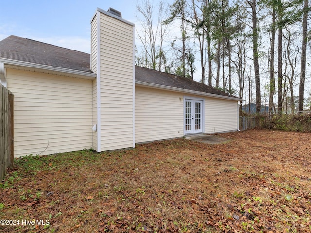 view of side of home featuring french doors