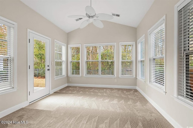 unfurnished sunroom featuring ceiling fan and vaulted ceiling