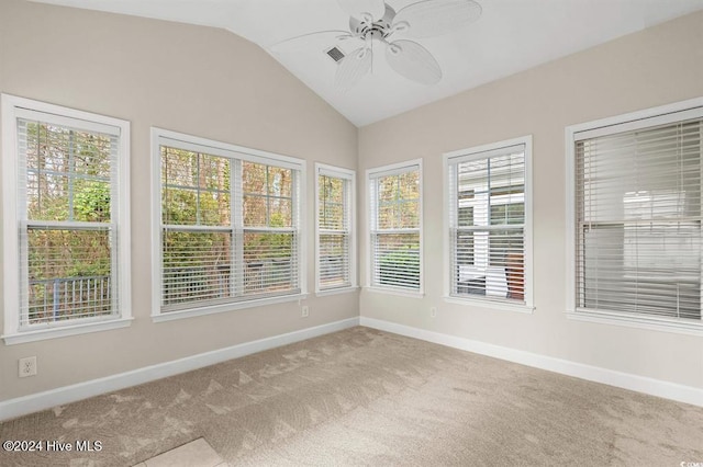 unfurnished sunroom with ceiling fan and lofted ceiling