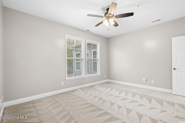 carpeted empty room with ceiling fan