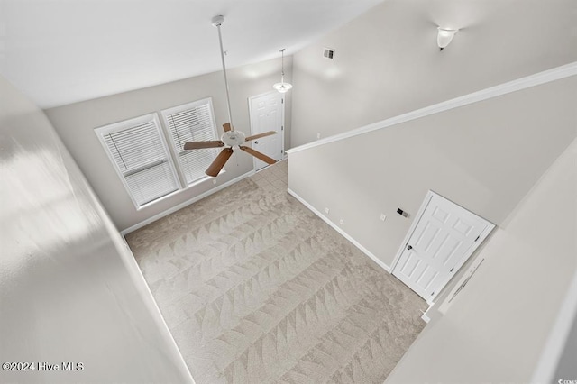 interior space featuring carpet flooring, ceiling fan, and high vaulted ceiling