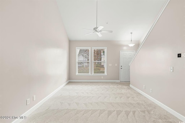 unfurnished living room with ceiling fan and light colored carpet