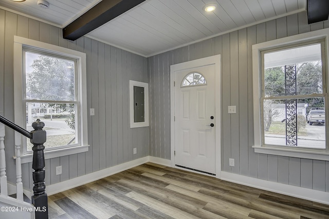 entrance foyer with beam ceiling, light hardwood / wood-style floors, and plenty of natural light