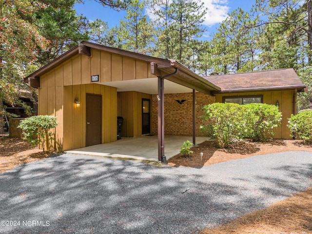 view of front of property with a carport