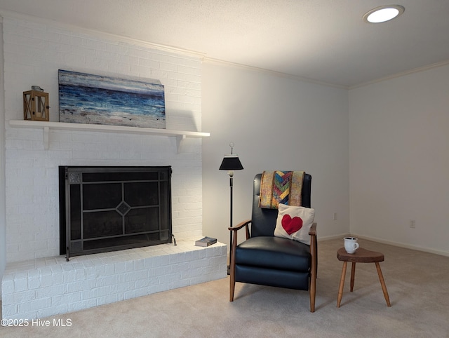 sitting room with carpet flooring, a fireplace, and ornamental molding