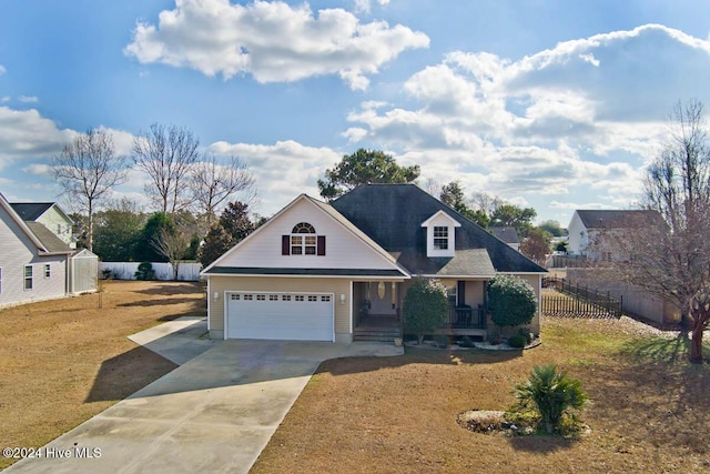 view of front of home featuring a garage and a front lawn