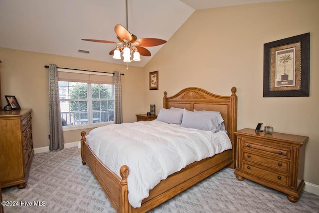 bedroom with ceiling fan, light carpet, and lofted ceiling