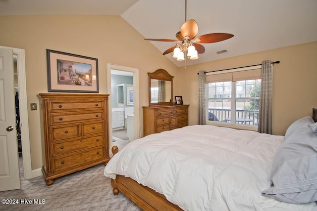 carpeted bedroom with connected bathroom, ceiling fan, and lofted ceiling