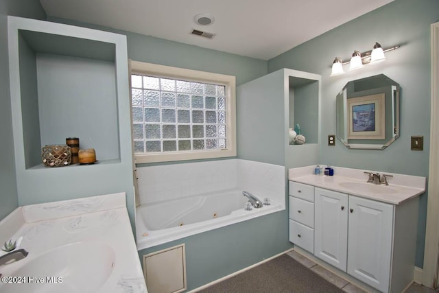 bathroom with vanity and a bathtub