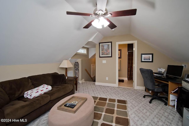 carpeted office space with vaulted ceiling and ceiling fan