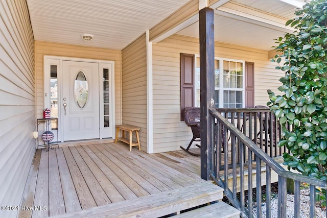 property entrance featuring a porch