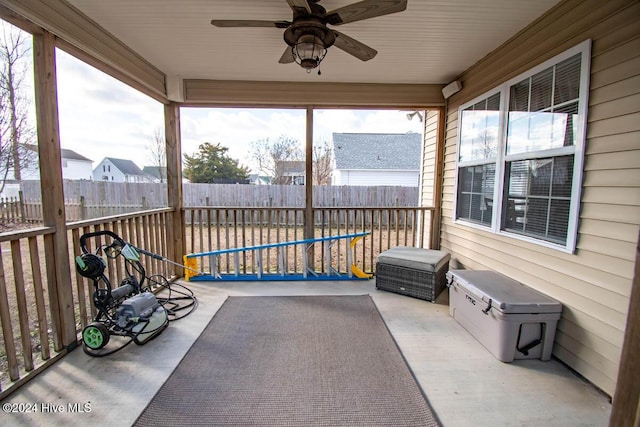 sunroom featuring ceiling fan