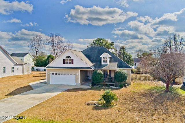 view of front of property featuring a front yard and a garage