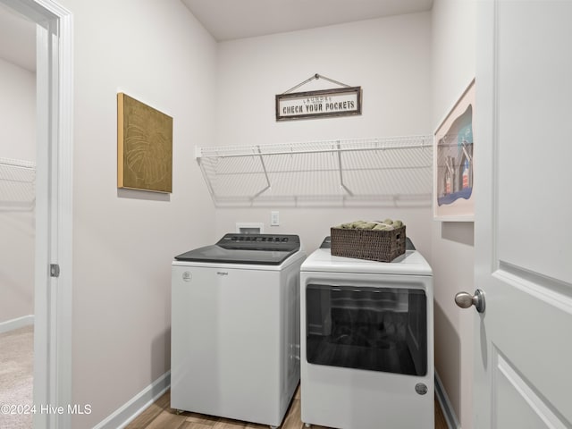 clothes washing area featuring washing machine and dryer