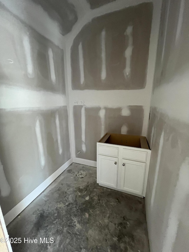 bathroom with concrete floors