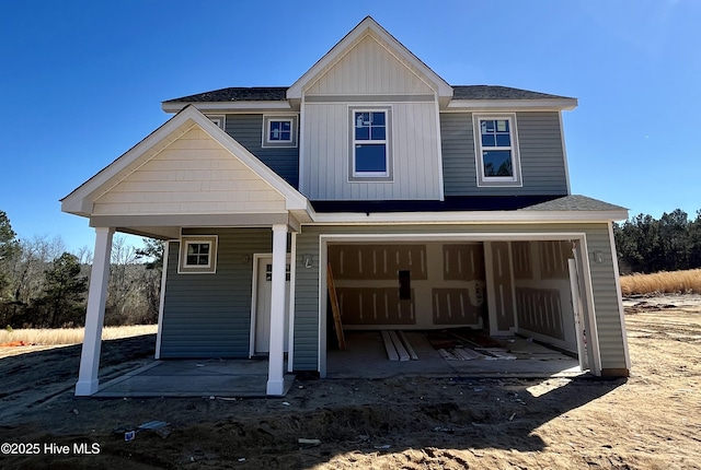 view of front facade featuring a garage and a porch