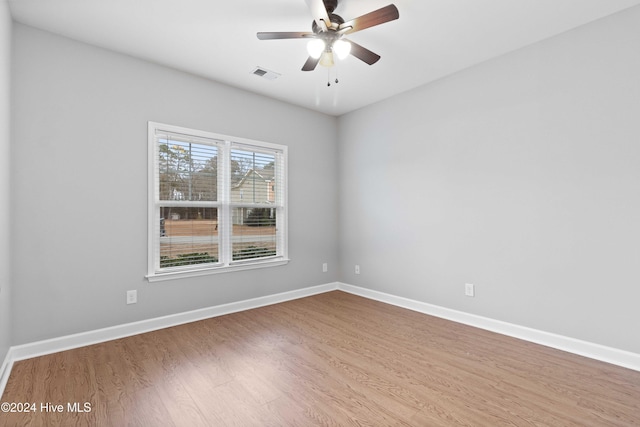 unfurnished room featuring ceiling fan and wood-type flooring