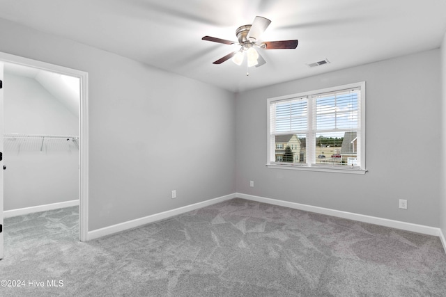 spare room with light colored carpet and ceiling fan