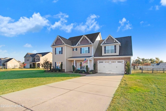 view of front of property featuring a garage and a front yard