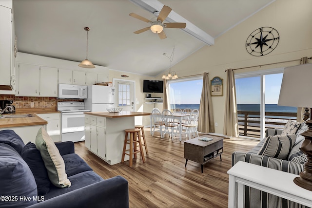 living room with sink, high vaulted ceiling, light hardwood / wood-style floors, ceiling fan with notable chandelier, and beamed ceiling