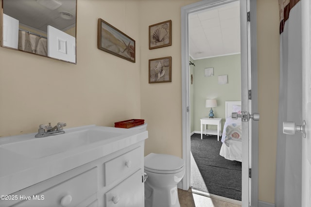 bathroom featuring vanity and toilet