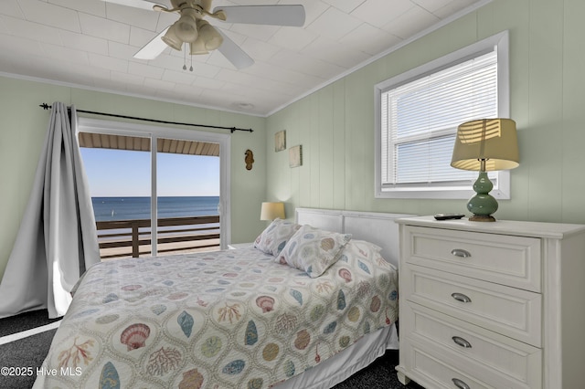 bedroom featuring a water view, ceiling fan, access to exterior, and crown molding