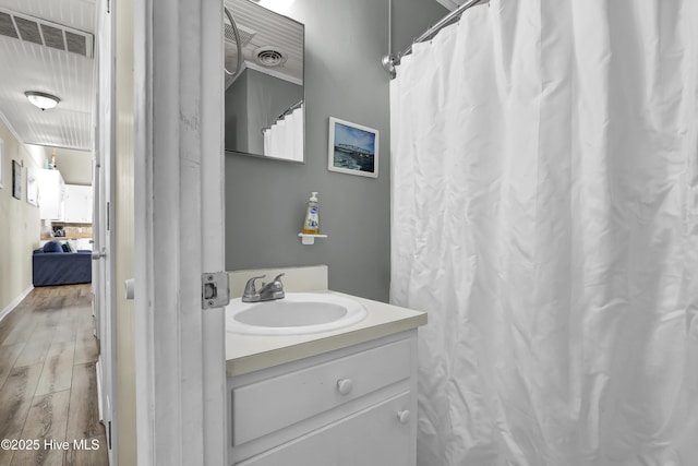 bathroom with wood-type flooring and vanity