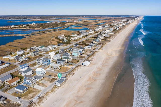 aerial view featuring a water view and a view of the beach